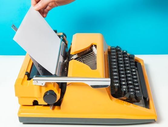 Typing machine blue background