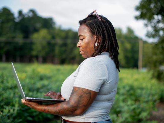 Woman on computer with AI