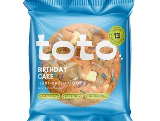 Blue package of a “toto” plant-based Birthday Cake cookie, featuring the cookie image on the wrapper.