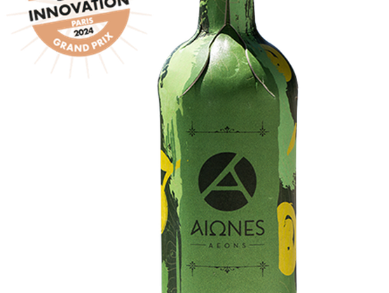 Bouteille verte Aiones (Aeons) arborant un logo circulaire noir et des illustrations de citrons jaunes, avec un badge « Innovation Paris 2024 Grand Prix » affiché en haut à gauche.