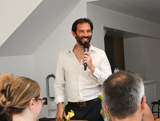 Speaker addressing guests with a microphone during the SIAL Insights 2026 press lunch in Paris.