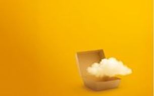 Small box with white foam placed on a surface, on a minimalist yellow background.