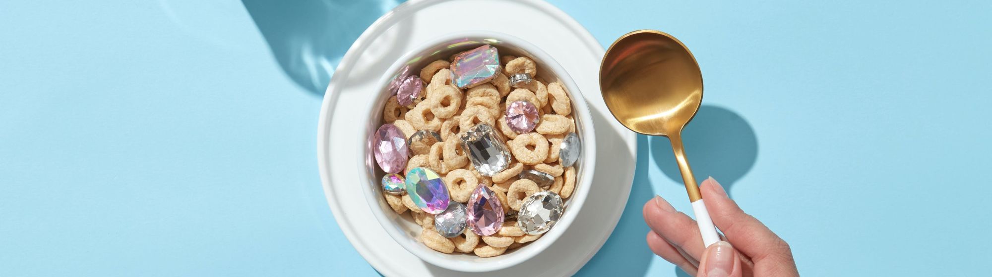 Cereal in bowl with glass of milk