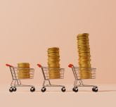 3 shopping trolleys with coins in a growing pile