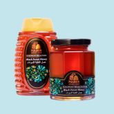 Two Fulmer honey containers, one squeeze bottle and one glass jar, displayed on a light blue background.