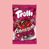 Trolli Flavor Bomb cherry cola candy pouch on a pink background.