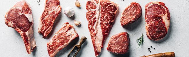 Different cuts of red meat on the table