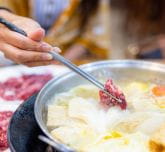 Chopsticks that hold a piece of meat