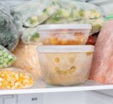 A jar of frozen vegetables with a smile on it