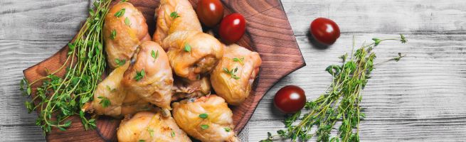 Pieces of chicken on a wooden board