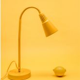 Yellow desk lamp with a lemon beside it