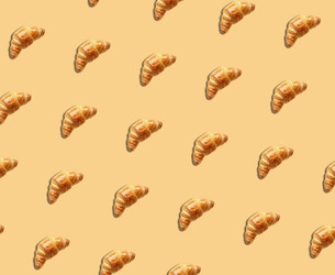 Repeating pattern of golden croissants on a beige background, designed as a decorative graphic element.
