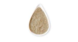Beige plant-based paste presented in a drop-shaped spoon.
