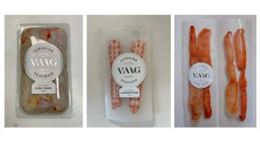 Transparent packaging containing ready-to-eat pieces of king crab meat.