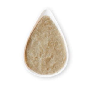 Beige plant-based paste presented in a drop-shaped spoon.
