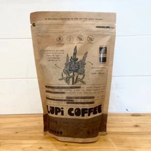 Dark roasted organic coffee "Lupi Coffee" packaging featuring lupin plant illustrations.