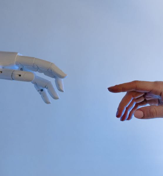 A robot hand and a human one