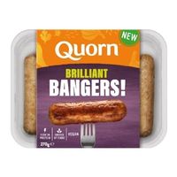 Tray of plant-based mini sausage rolls in orange and green packaging.