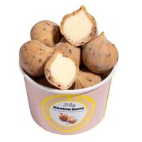 Cookie-style ice cream bites presented in a tub, product view on a light background.
