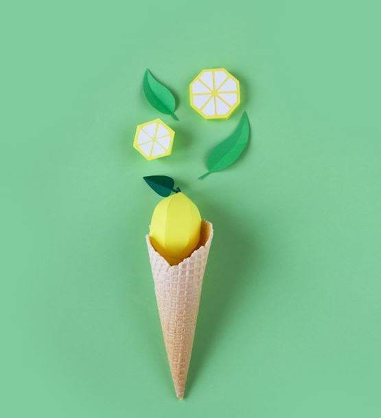 Fruit ice cream cone with graphic elements on a green background.