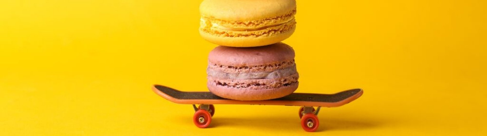 Two macarons stacked on a skateboard