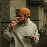 Person eating pizza