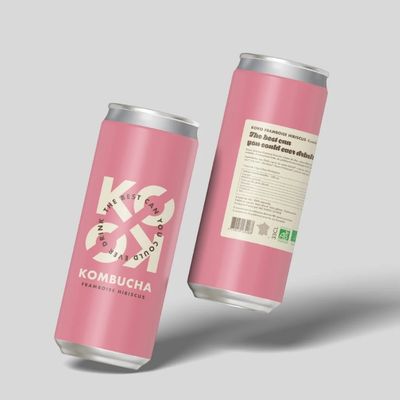 Pink kombucha cans aligned on grey background