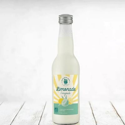 Artisan lemonade bottle on minimalist light background