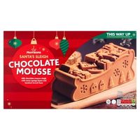 Frozen chocolate mousse log with festive decoration