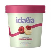 White chocolate ice cream with raspberry pieces in tub